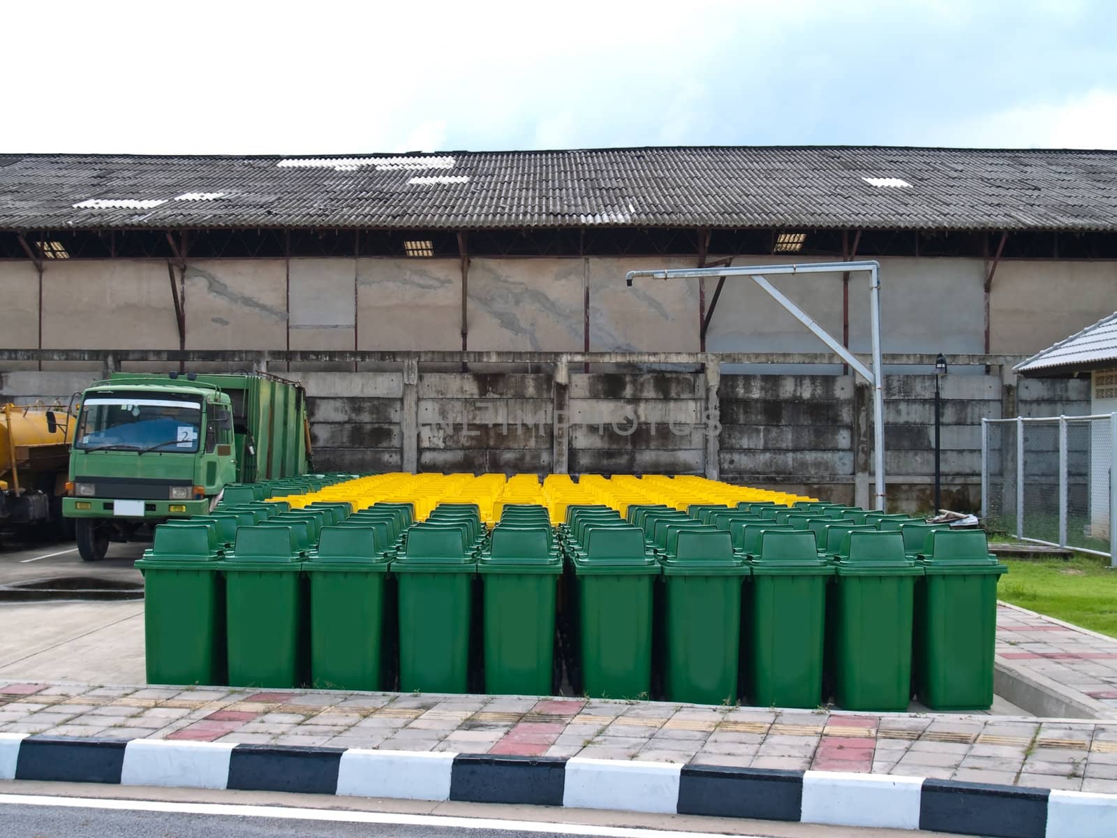 A lot of new usable public bin with refuse collection vehicle