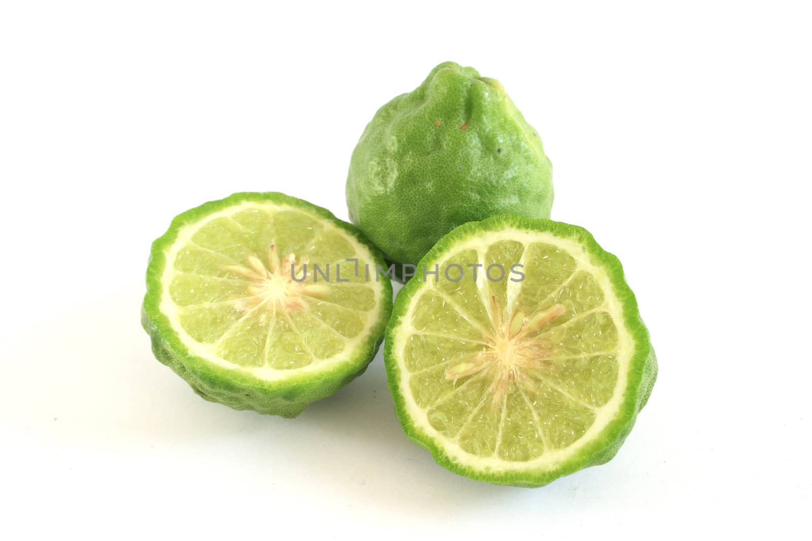 Kaffir limes on white background