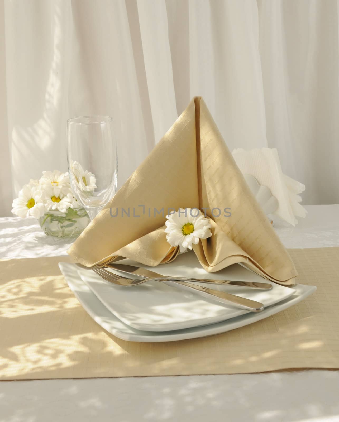 Coordinated decorative napkin on a plate with cutlery