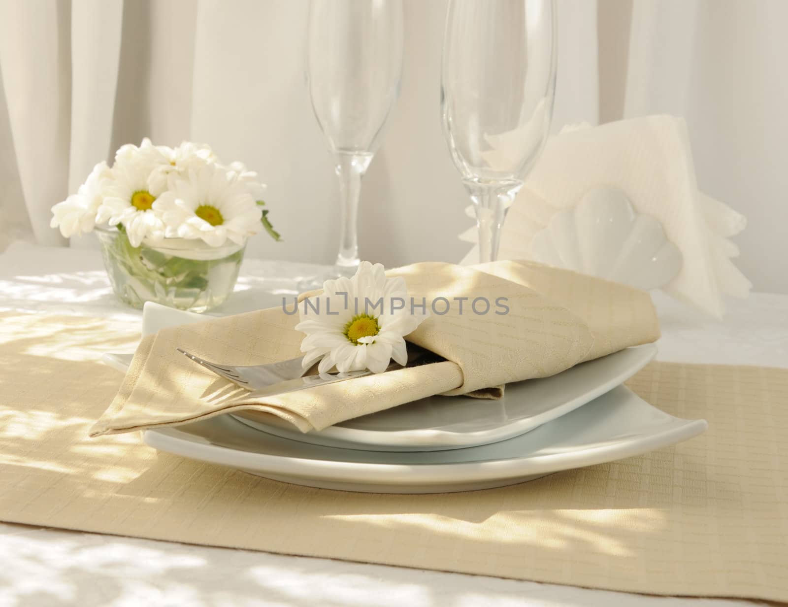 Coordinated decorative napkin on a plate with cutlery