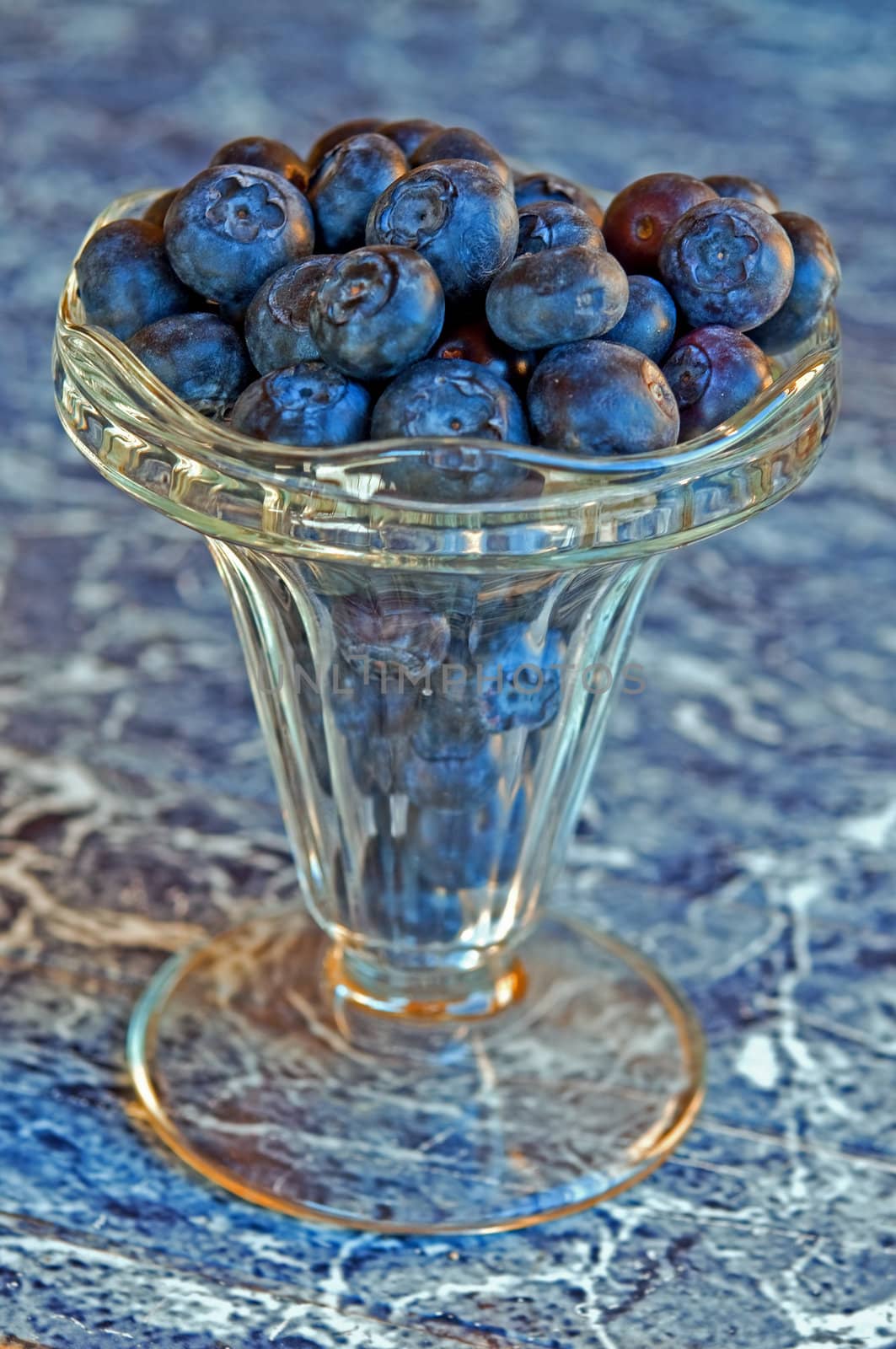 Blueberries in a crystal glass