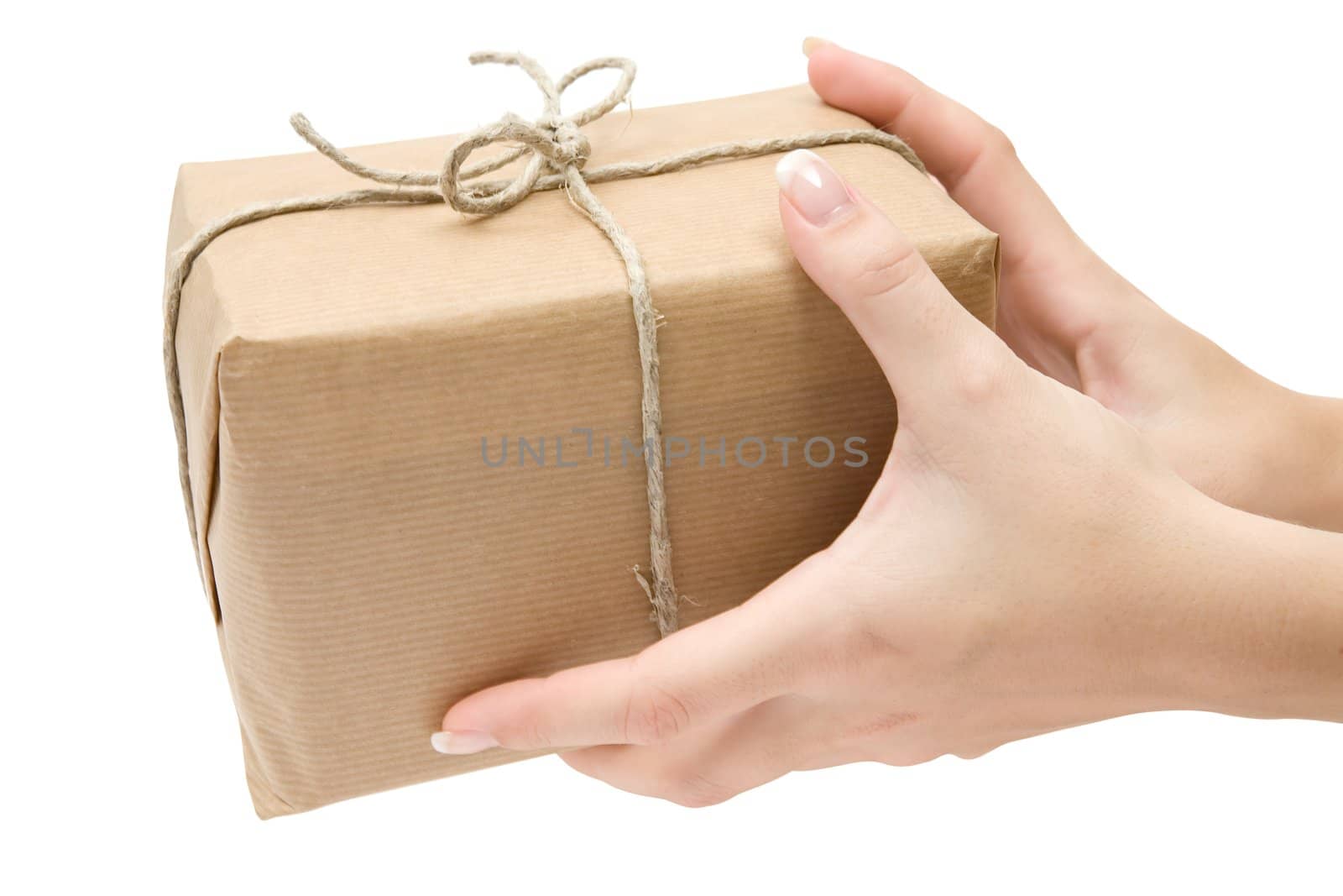 Female hands holding a brown parcel. Isolated on a white background.