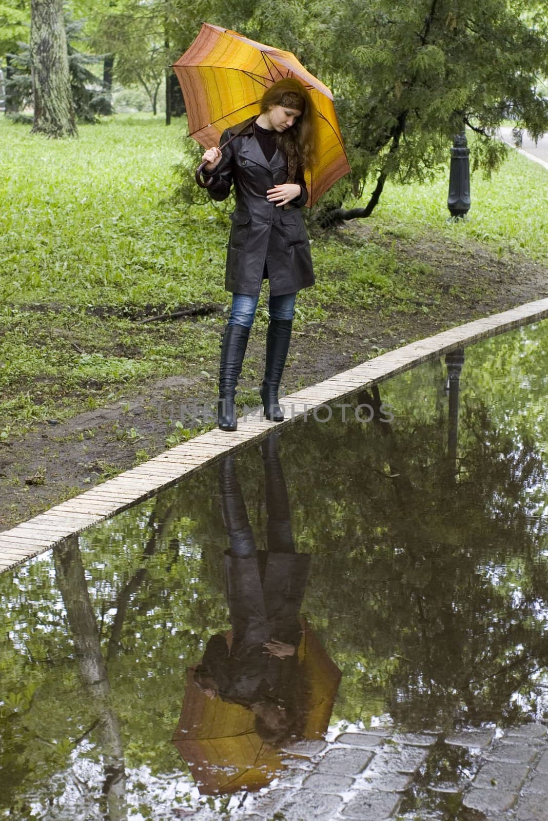 girl under a umbrella. Reflection