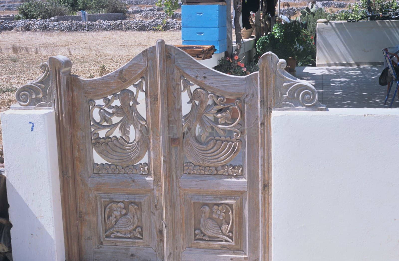 Traditional hand made wooden gate. Carved. Karpathos 08/2005.