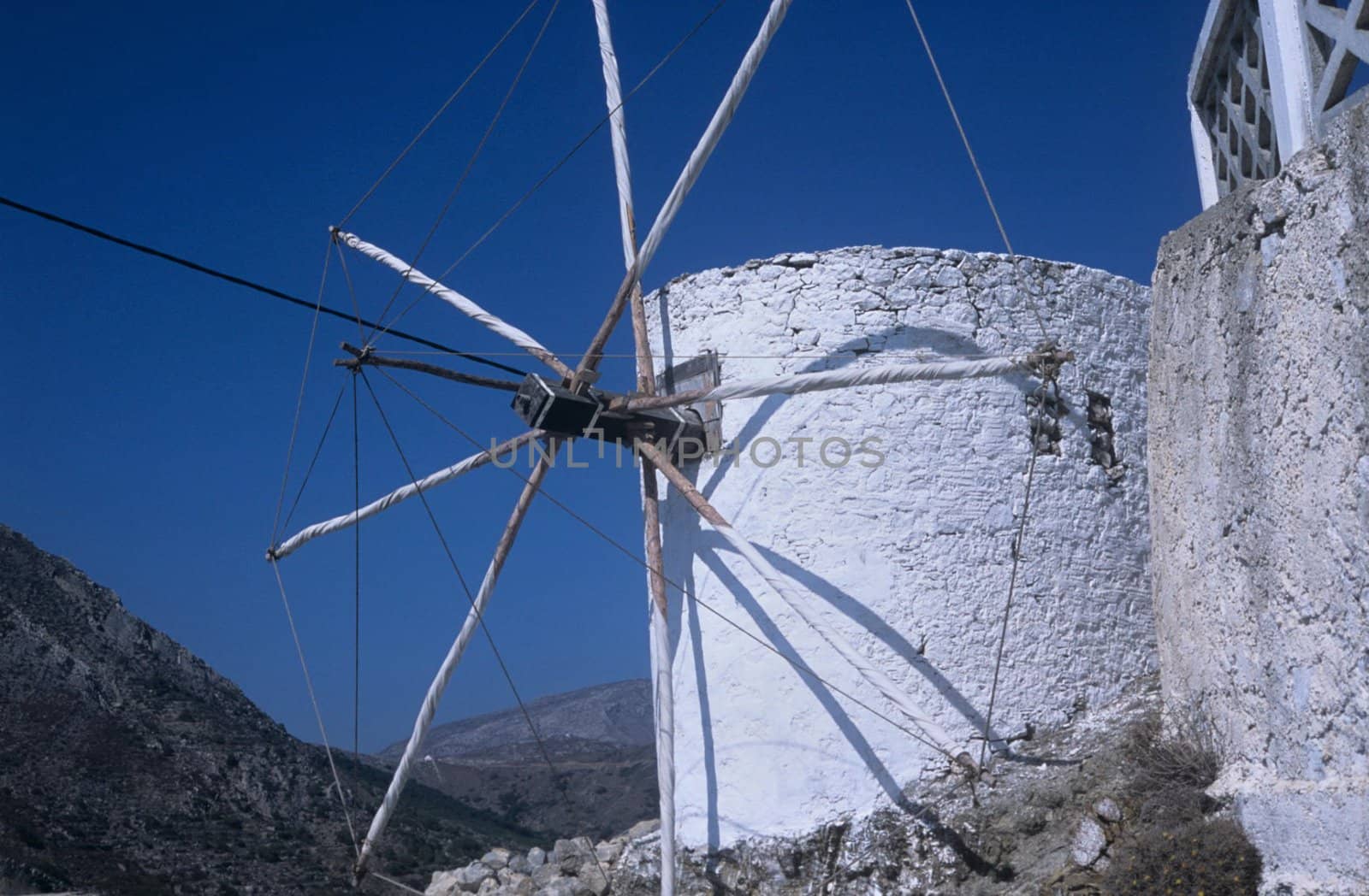 Taraditional stone built greek wind mill. Part of landscape in Olymbos and many other, lost villages.