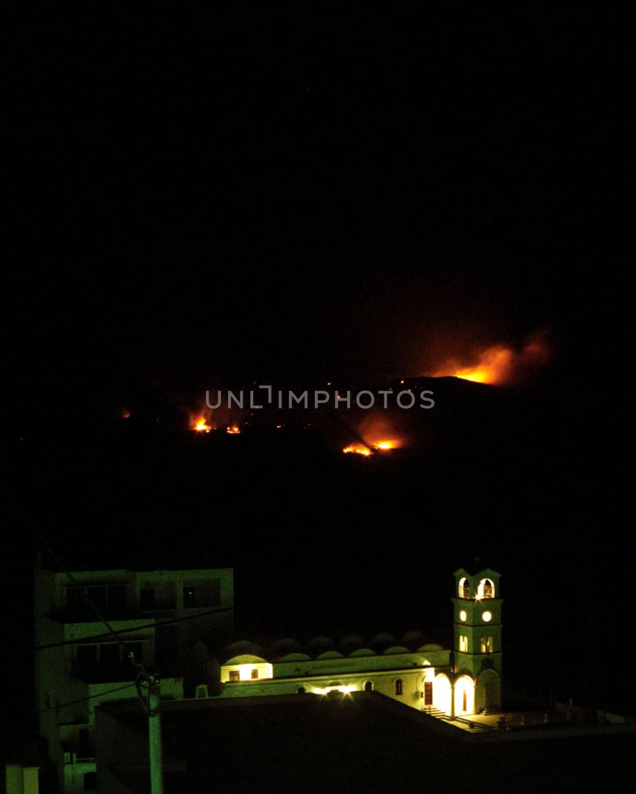 Fires are major problem in whole mediterranean. In Vilage Menets on Karpathos one could see in 08/2005 hills burning behind the old church.
