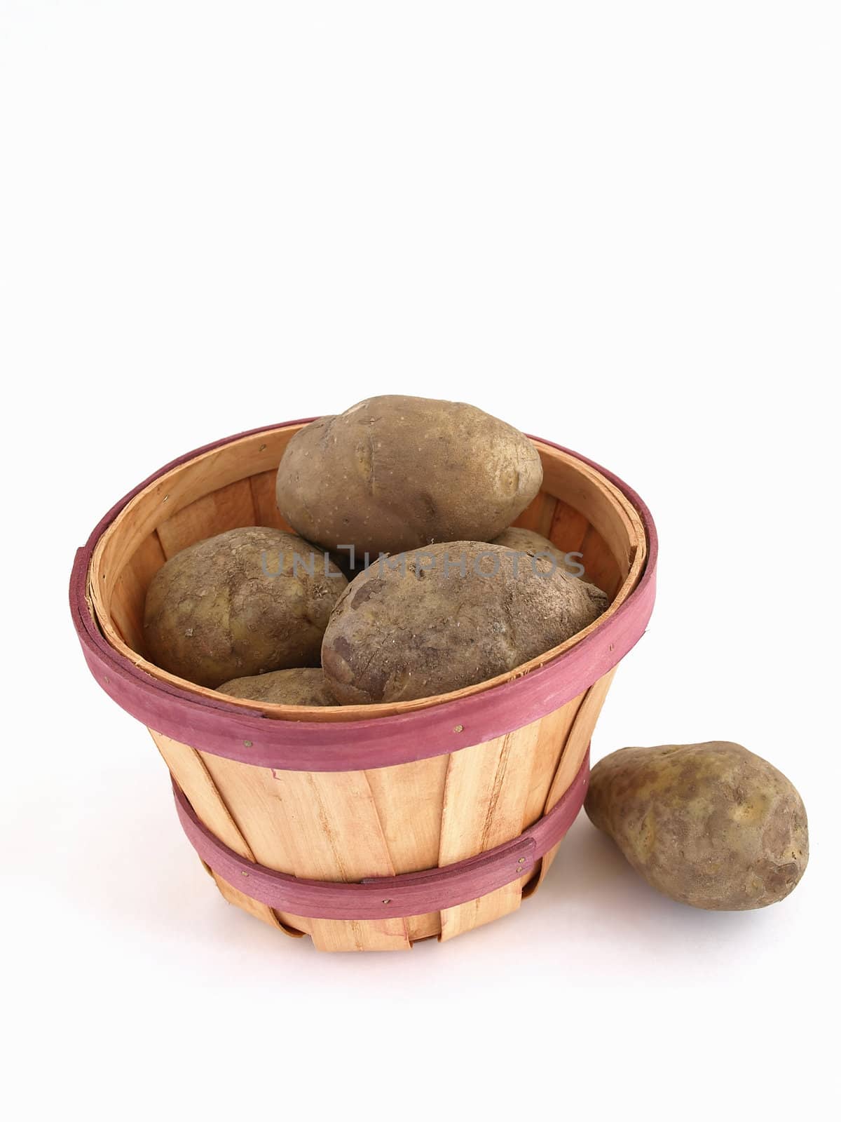 A basket of potatoes. Studio isolated on a white background.