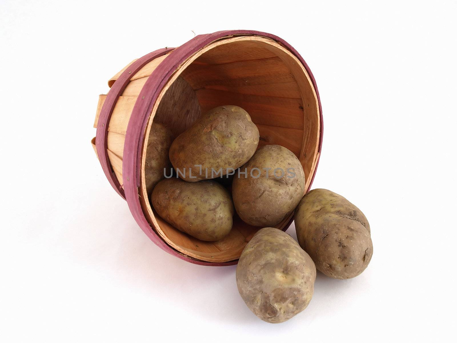 A basket of potatoes. Studio isolated on a white background.