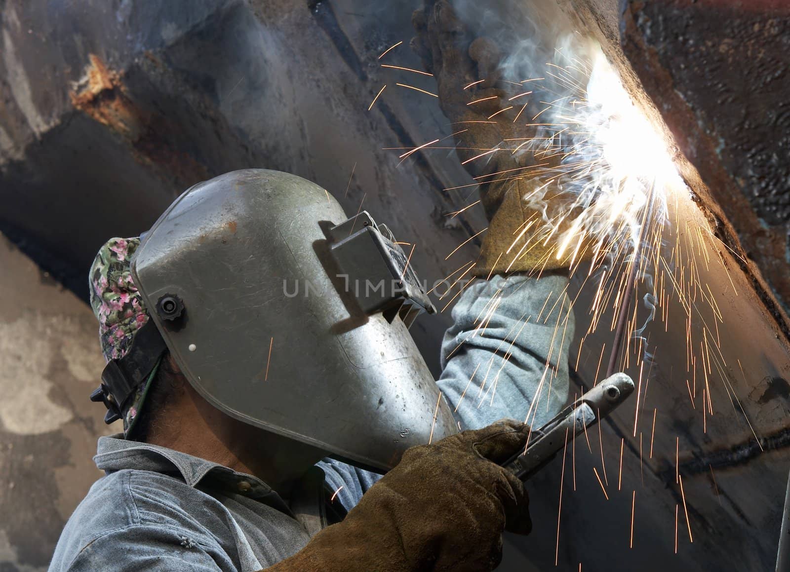 a metal welder busy at work