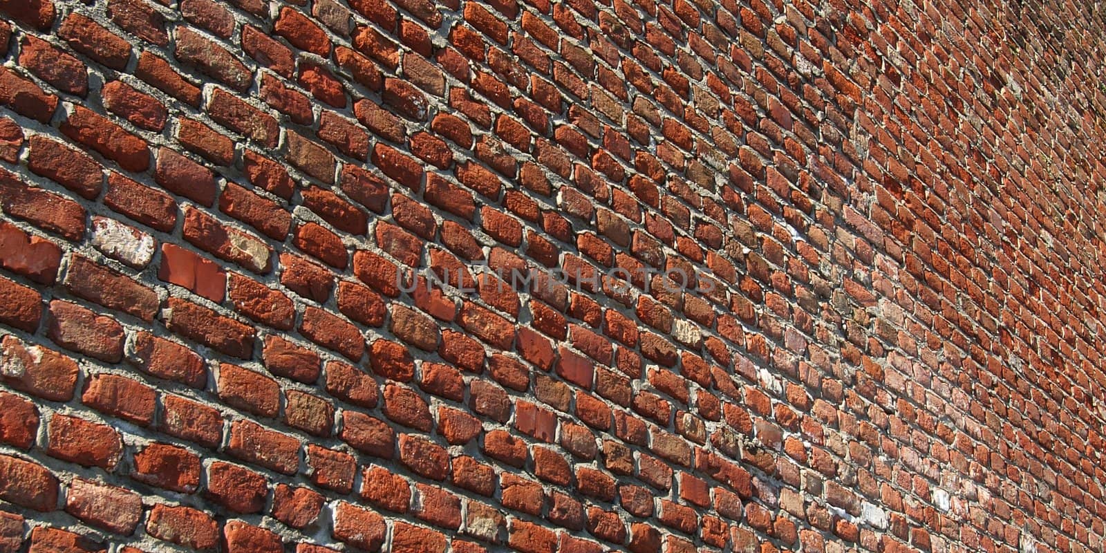 Red brick wall useful as a background - selective focus