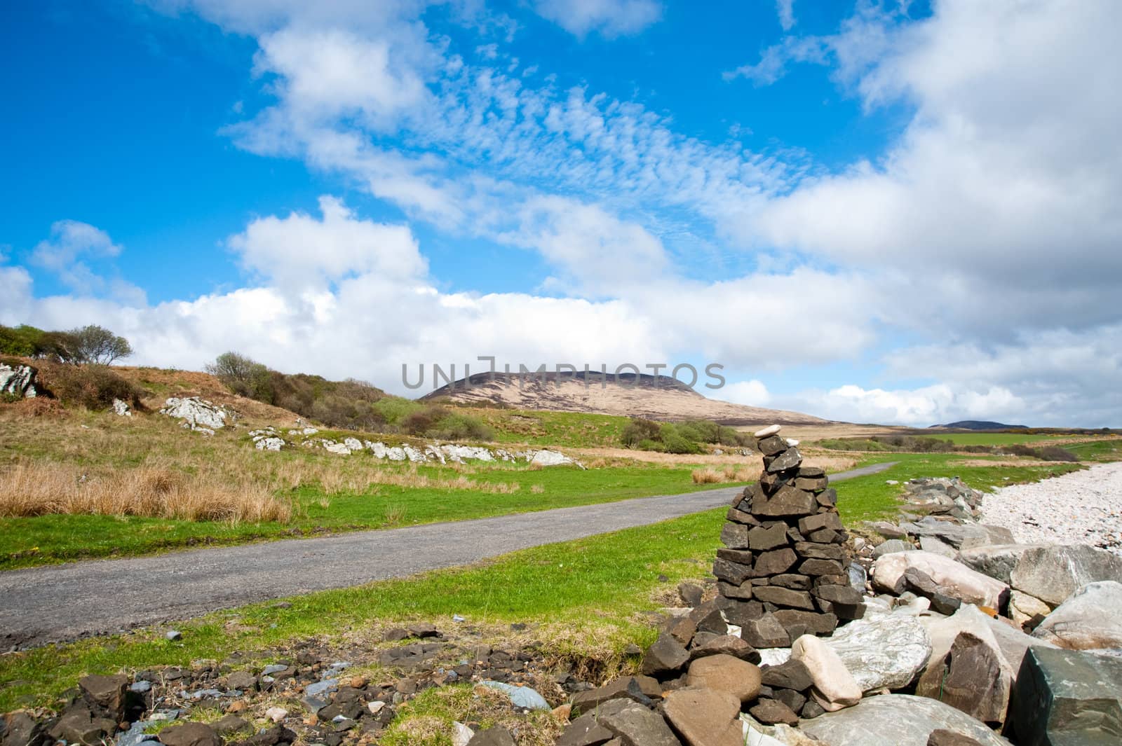 View of Islay coastline and cairn
