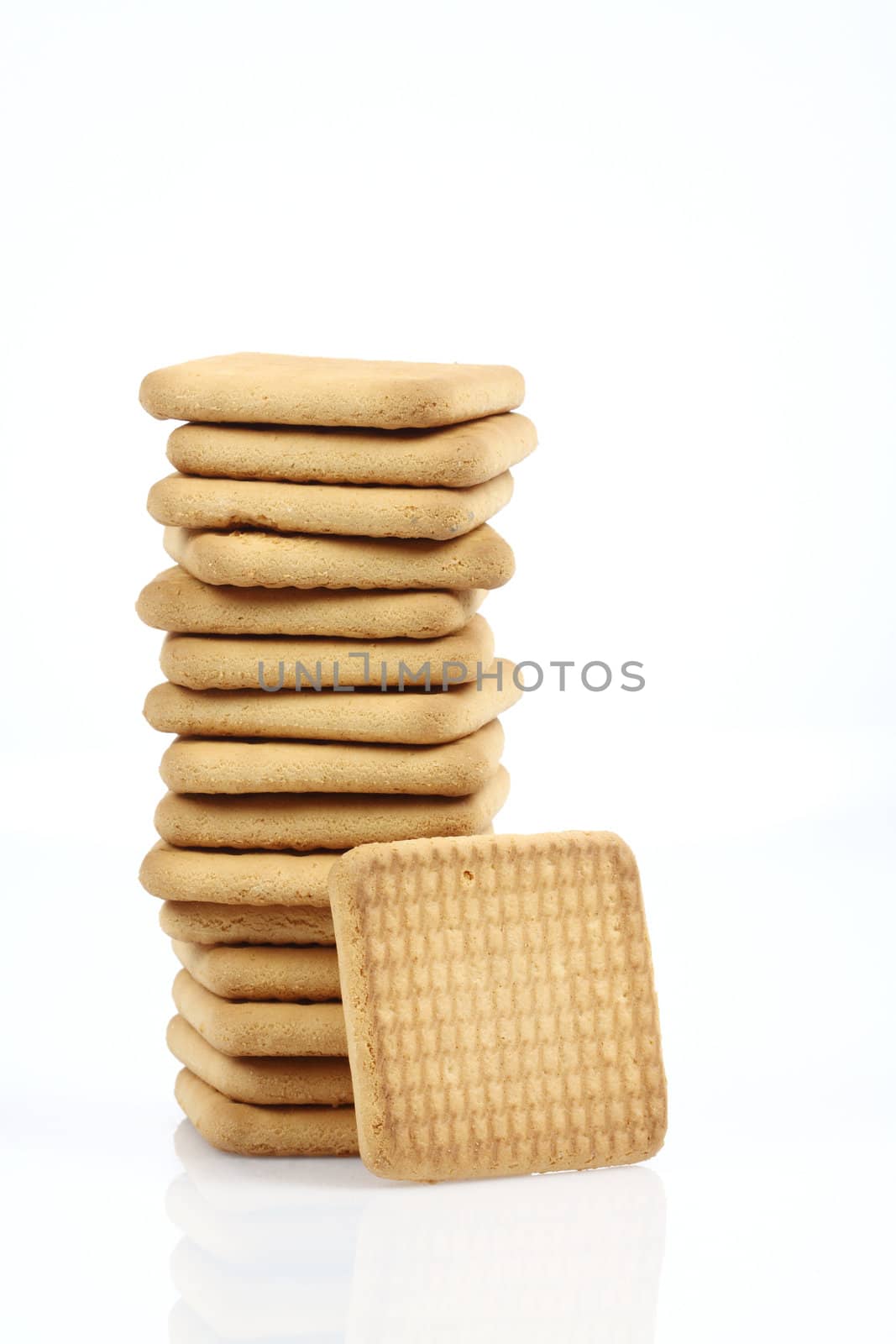 Stack of cookies close up over white