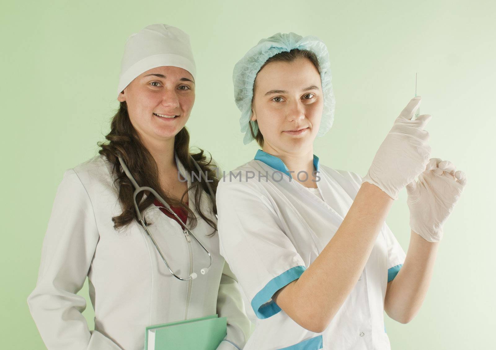 Two young lady doctors by AndreyKr