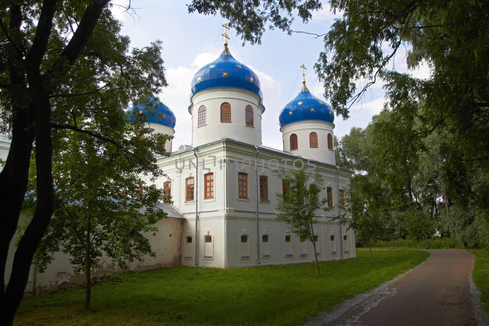 Russian Orthodox church of Juriev monastery in the trees. Novgoro, Russia