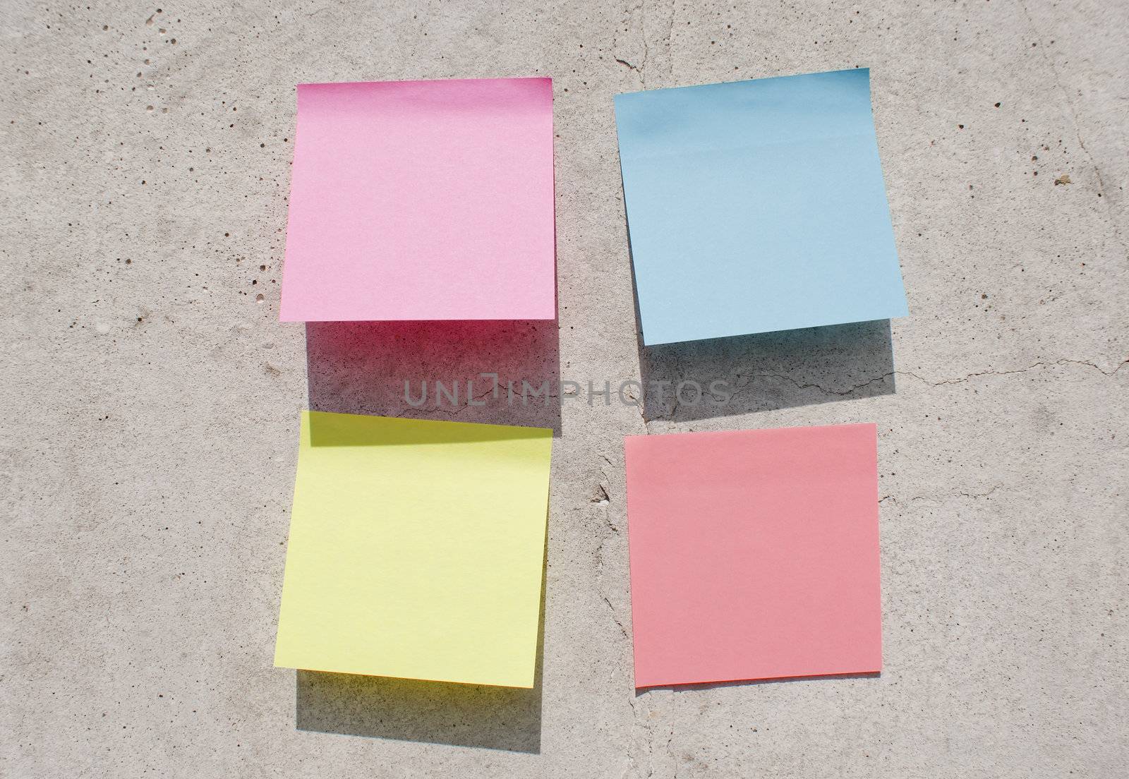 Sticky notes on the concrete wall by AndreyKr