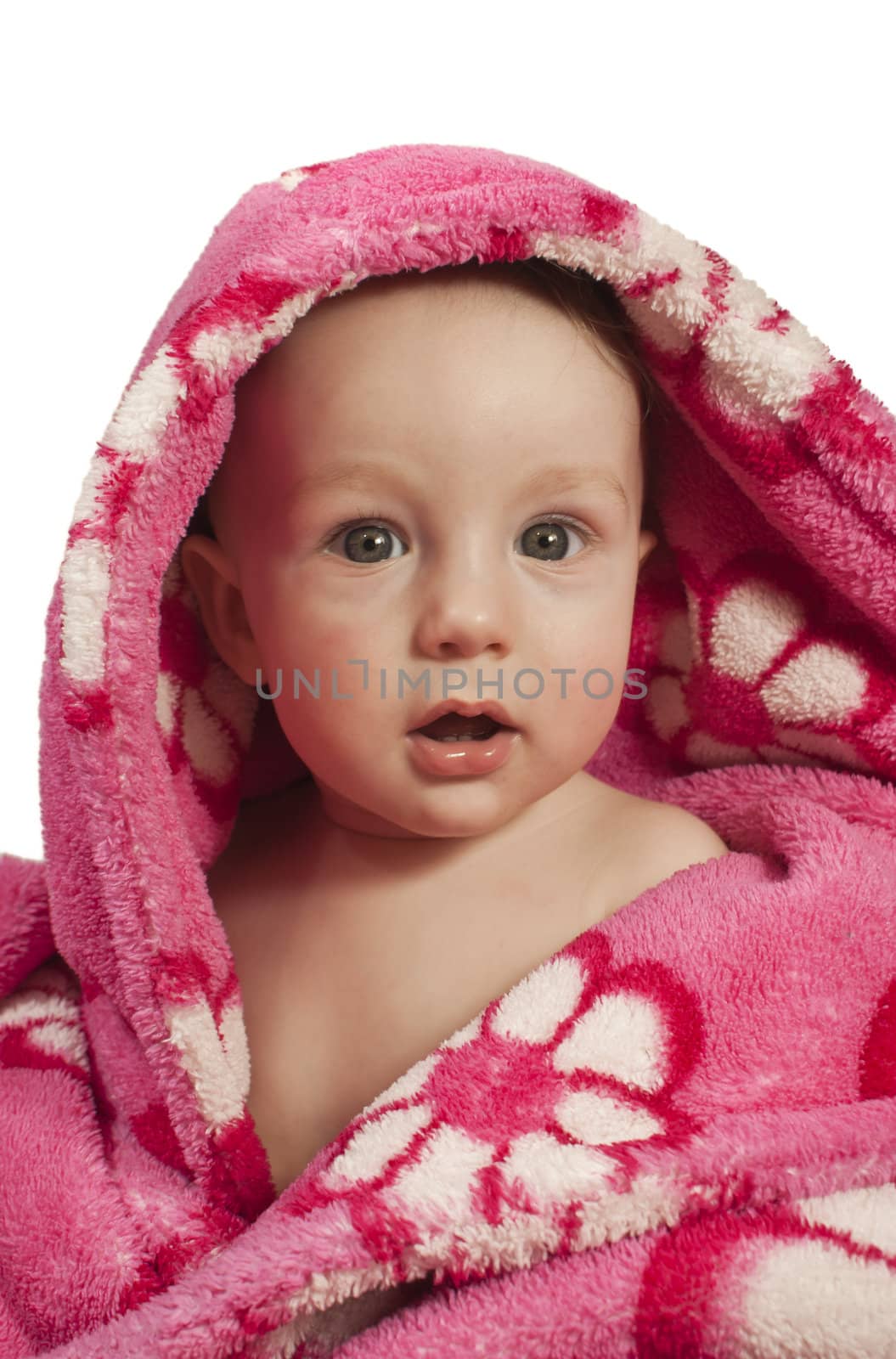 Little baby boy dressed in a rosy bathrobe