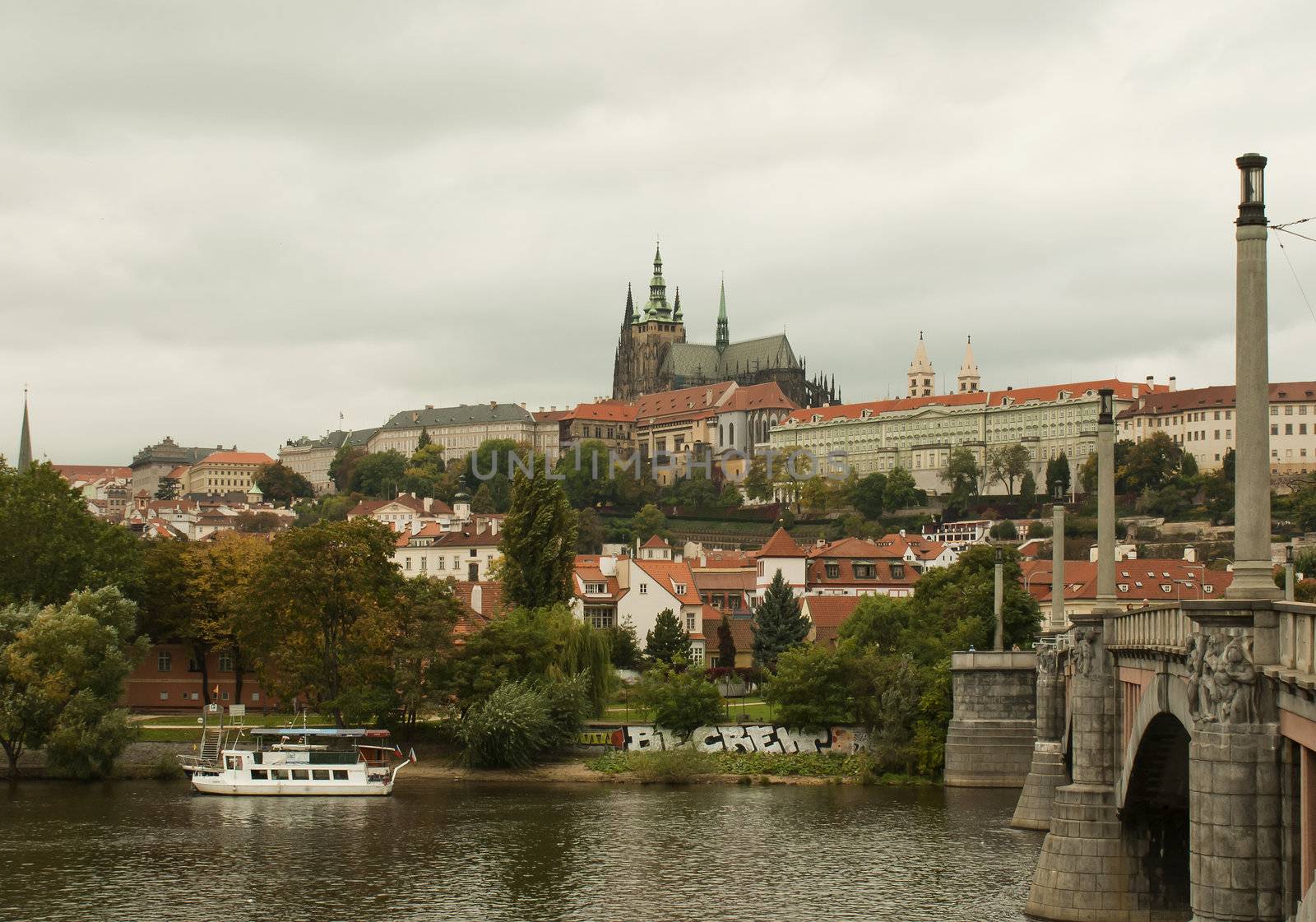 Castle and Charles bridge in Prague at the day time by AndreyKr