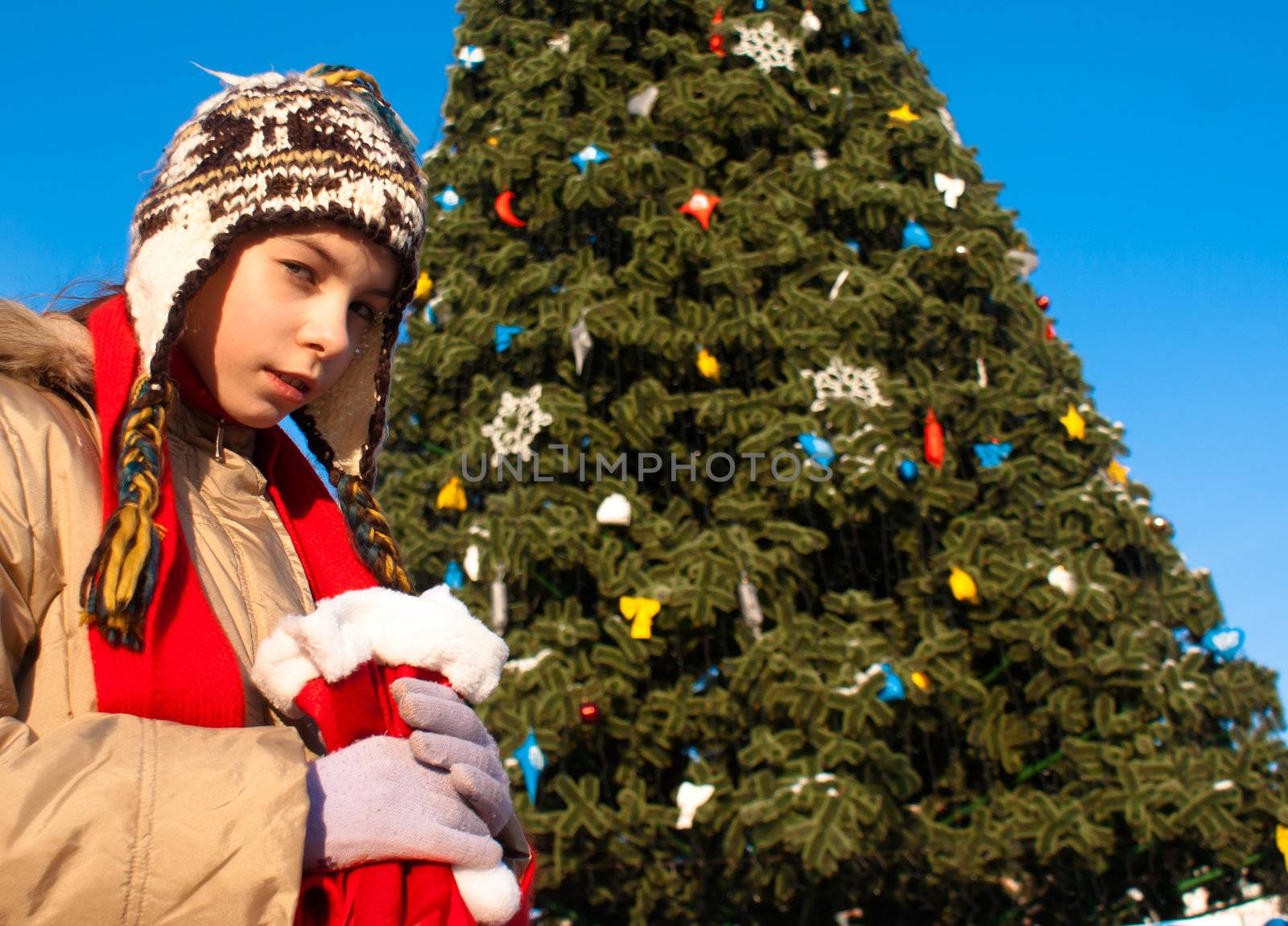 Girl holding a bag with Christmas presents by AndreyKr