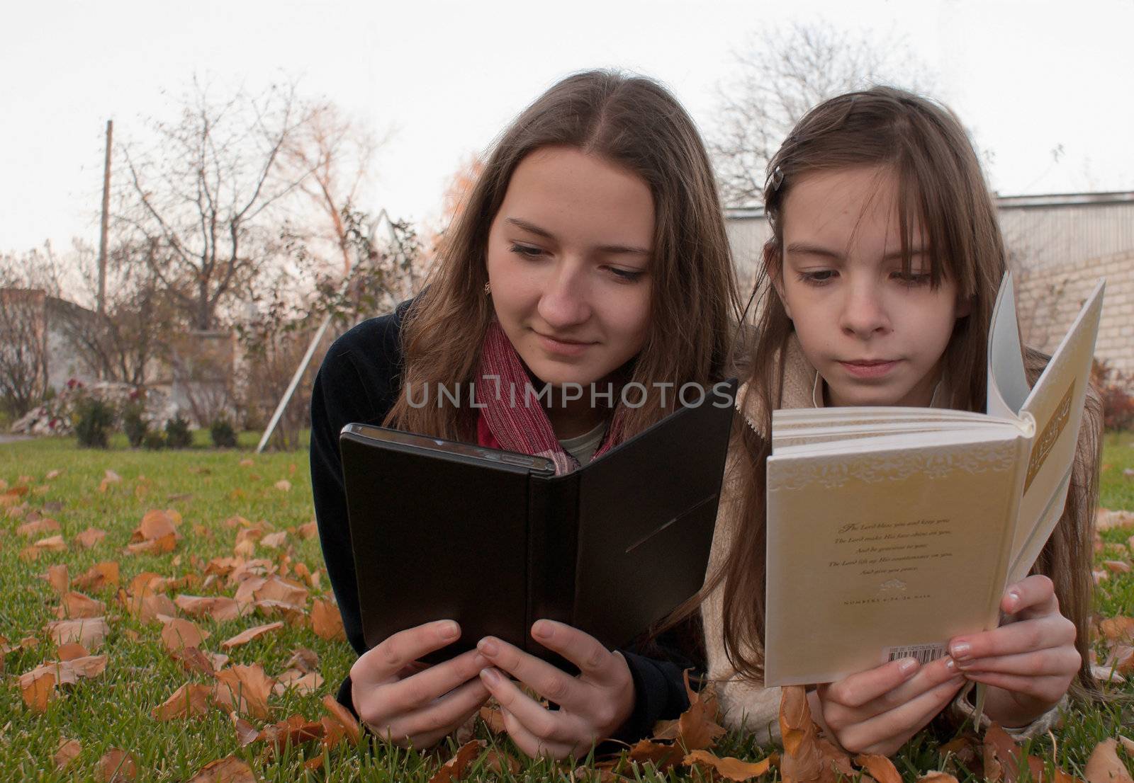 Girls reading books by AndreyKr