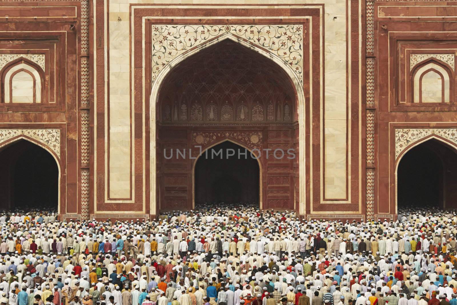 Thousands of people gather in front of the mosque at the Taj Mahal to celebrate the Muslim festival of Eid ul-Fitr in Agra, Uttar Pradesh, India