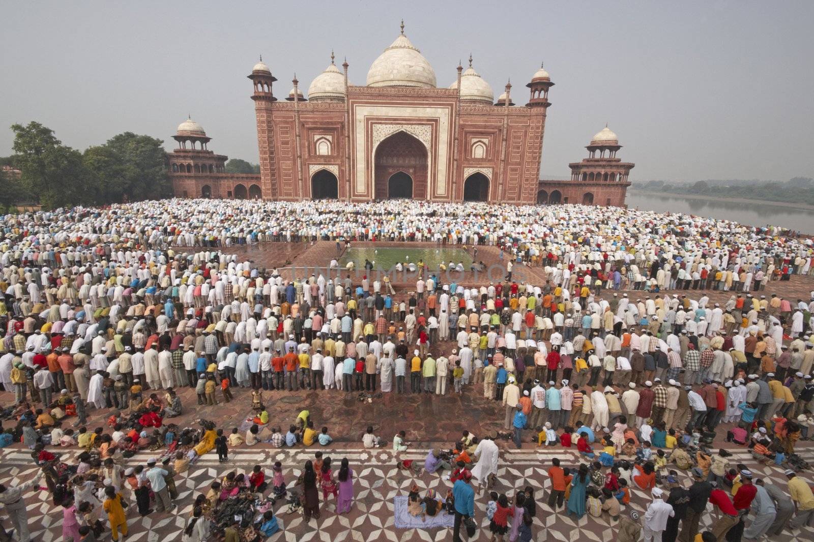 Thousands of people gather in front of the mosque at the Taj Mahal to celebrate the Muslim festival of Eid ul-Fitr in Agra, Uttar Pradesh, India