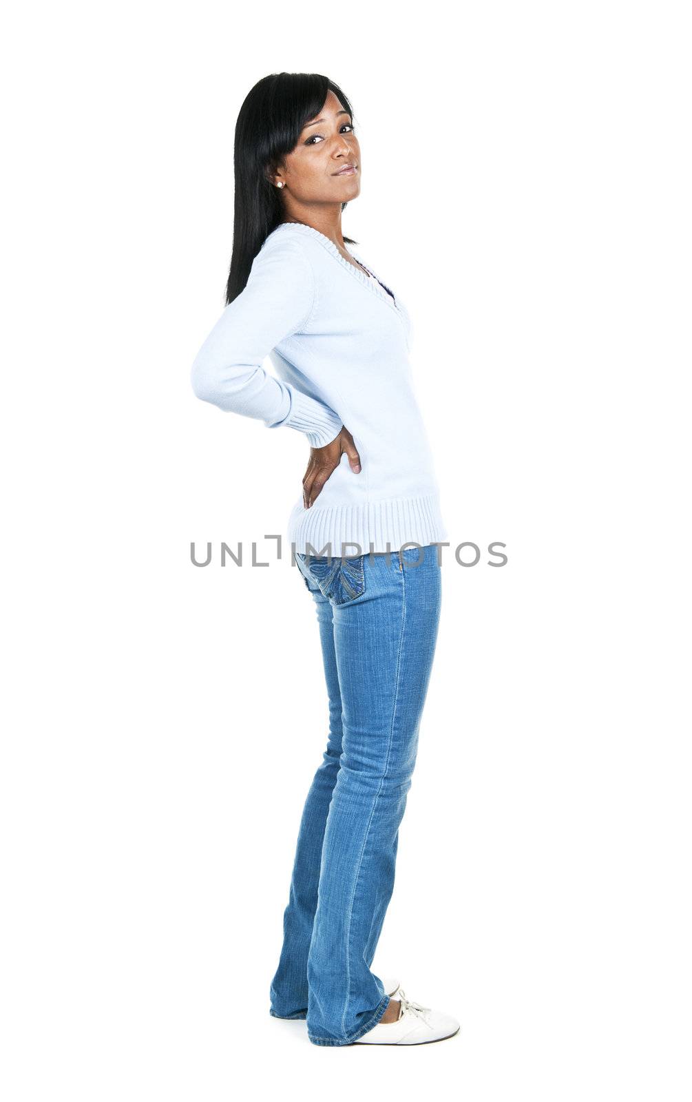 Black woman with back pain standing isolated on white background