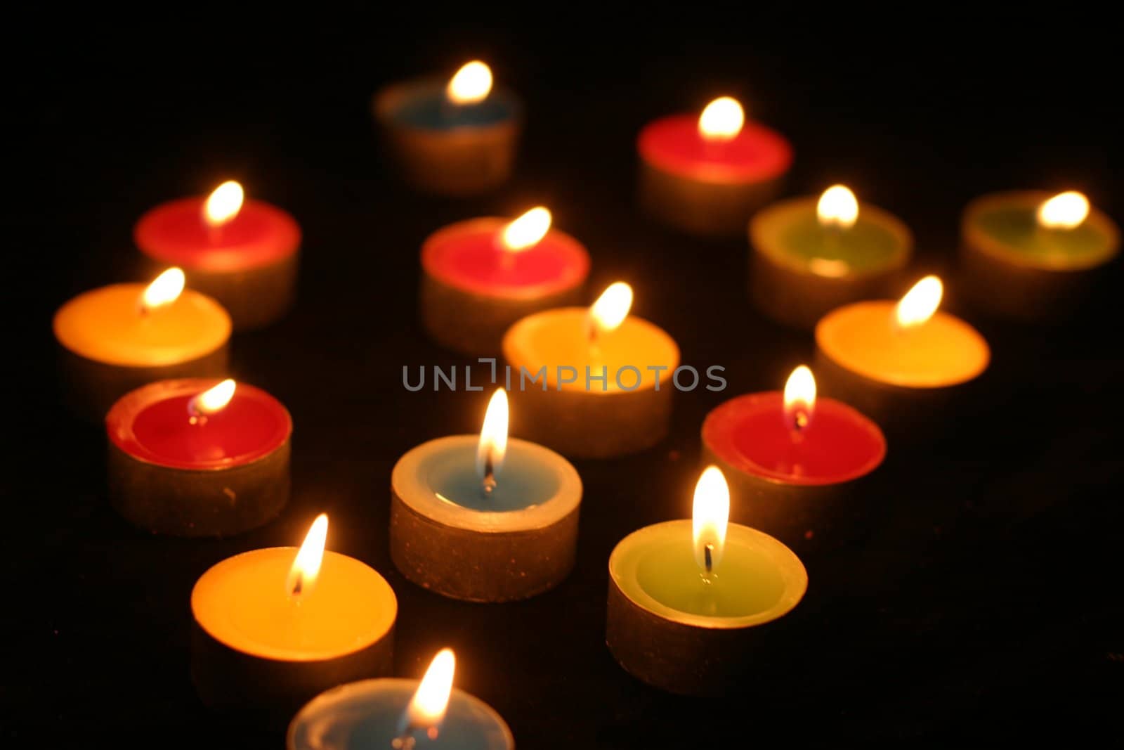 colourful candles on black