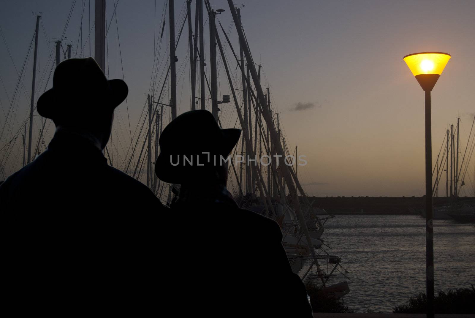 Shiluette. Lovers at the sunset at the port of Rome