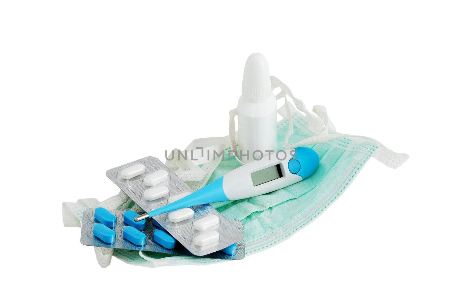 Set for flu treatment included thermometer, two types of pills, nasal spray and procedure mask isolated on white background