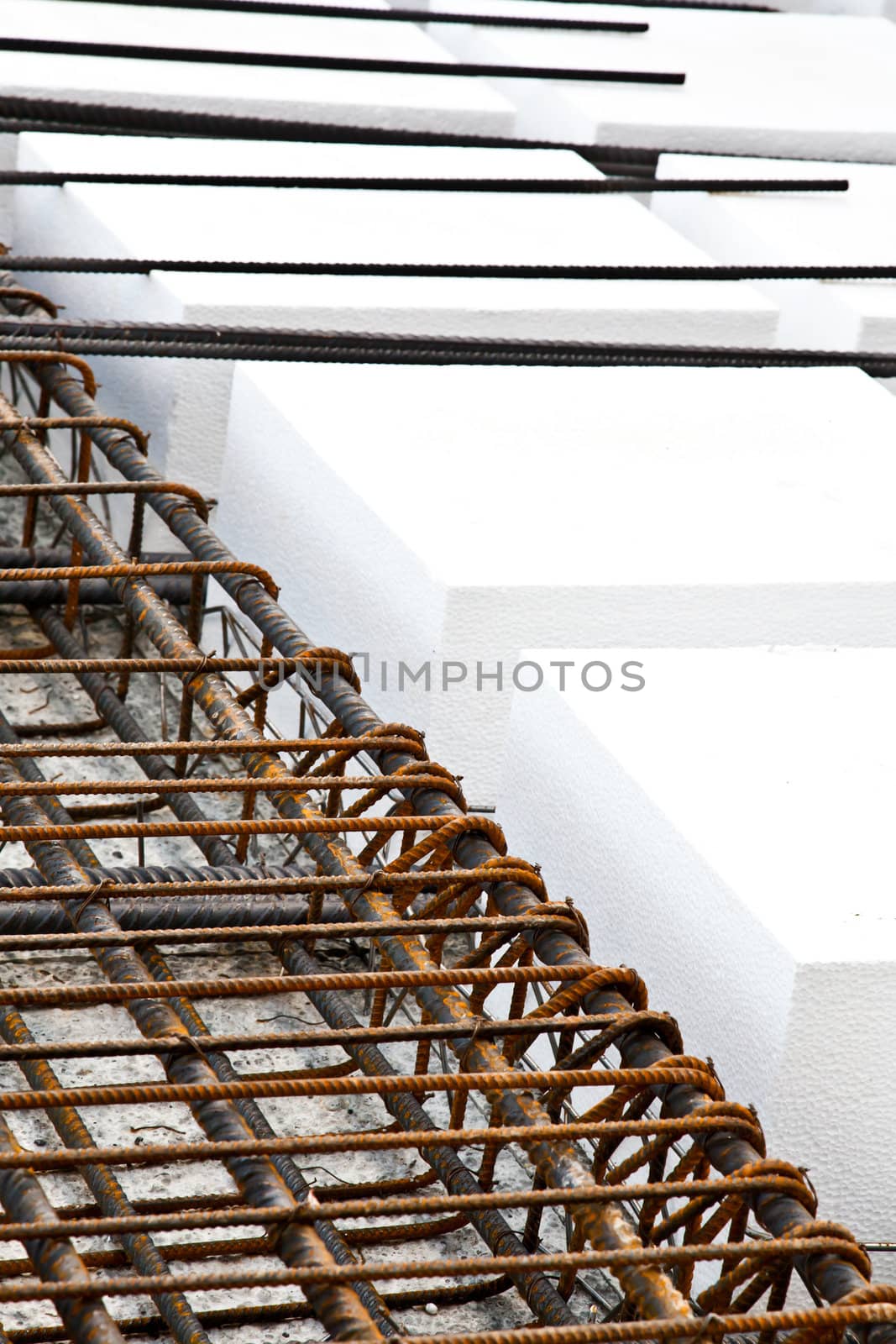 Technical detail of building operations: floor. Materials: polystyrene, steel bars, concrete