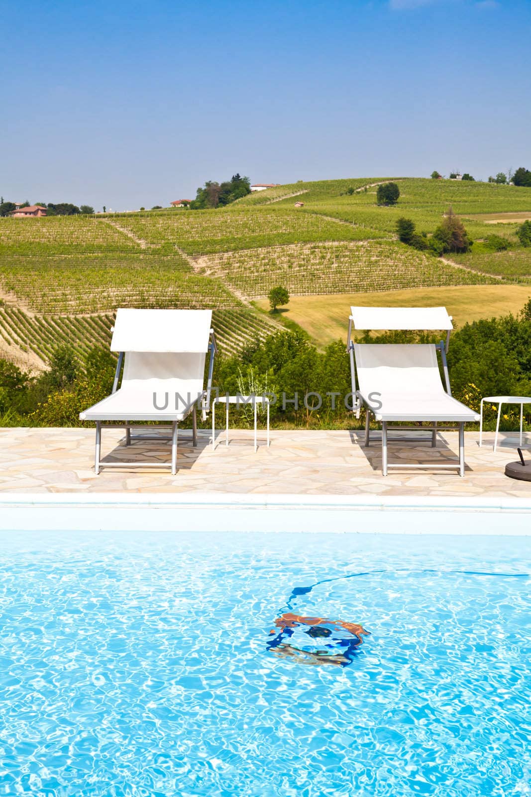Swimming pool of an Italian beauty farm in the middle vineyards, Monferrato area, Piemonte region.