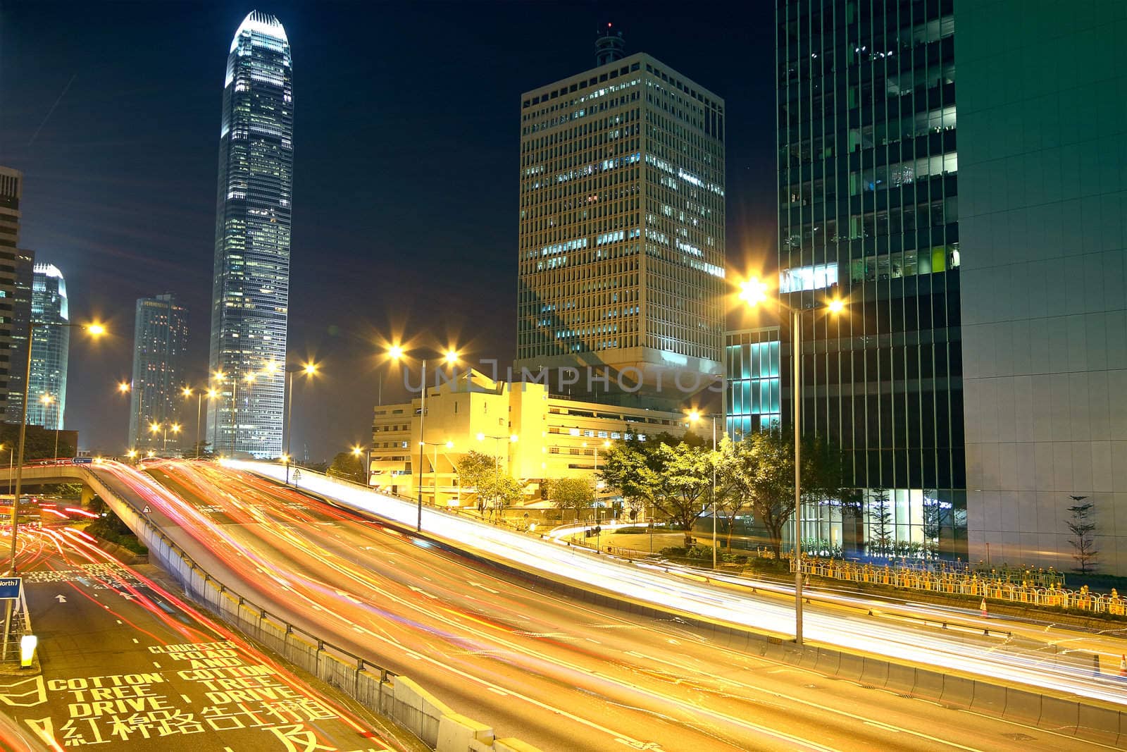 Colorful city night with lights of cars motion blurred in hong kong