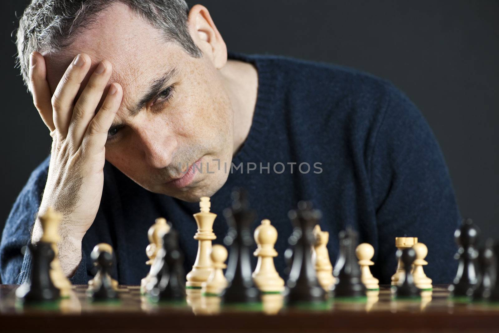 Man at chess board by elenathewise