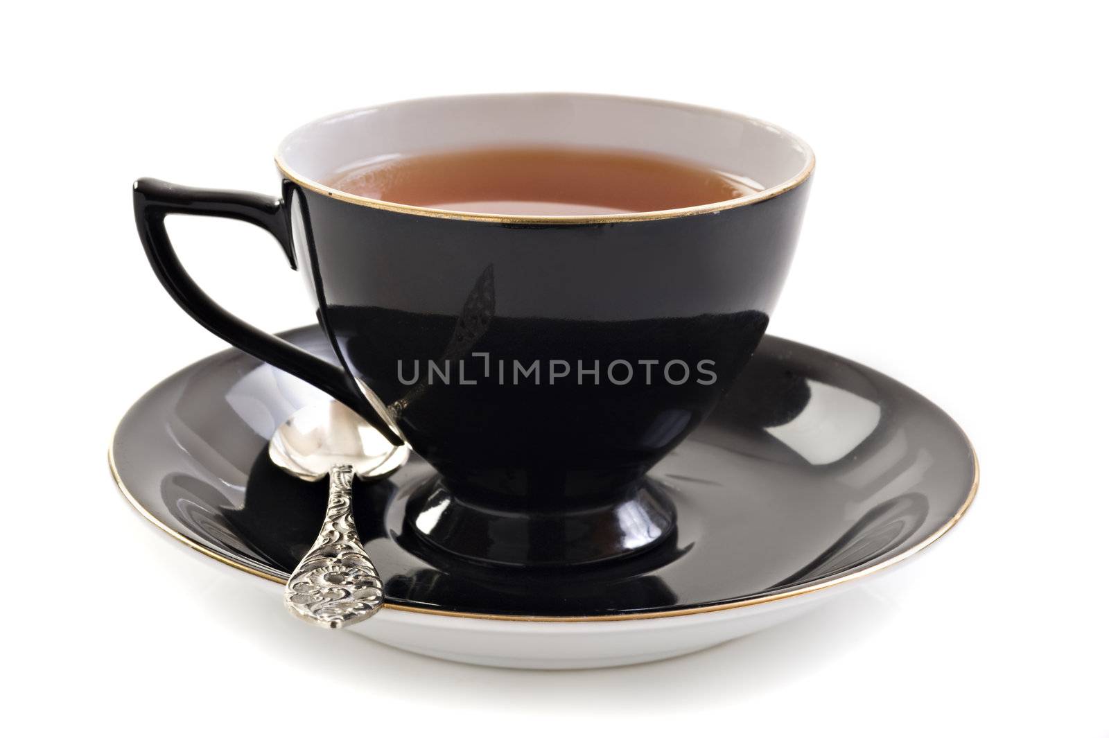 Black tea cup on a white background with space for text