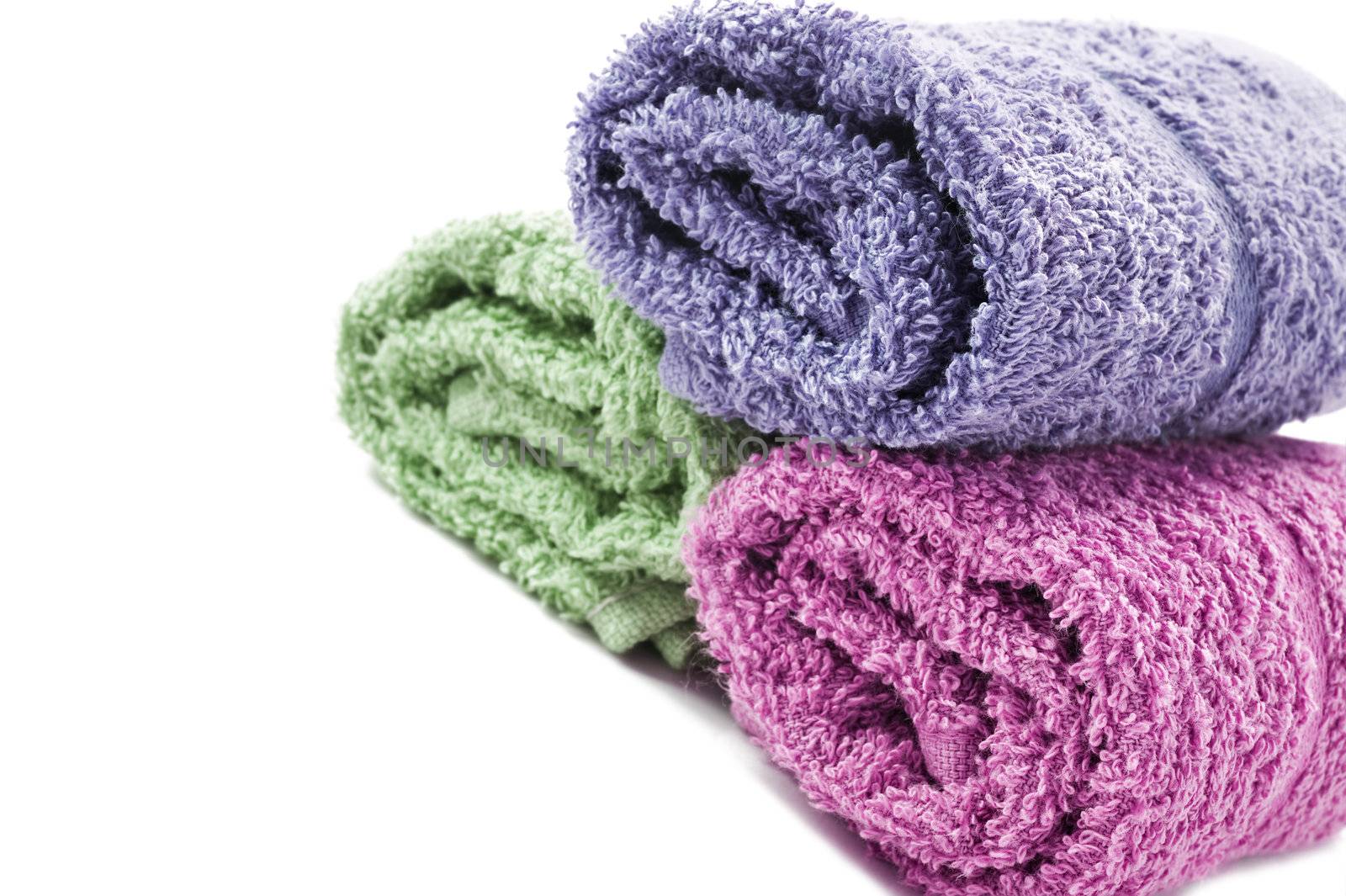 Fresh rolled up towels on a white background by tish1