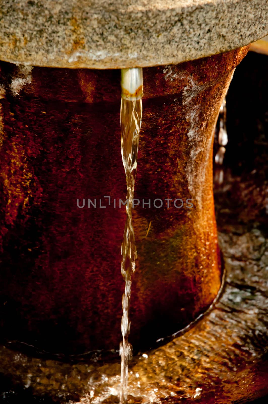 Flowing Spring Water in the Spa in Rusty Drinking Fountain