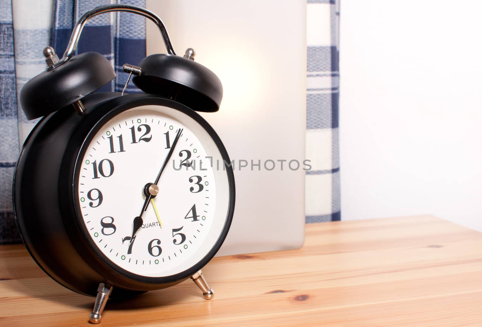 Alarm Clock and Reading Lamp on Bedside Table