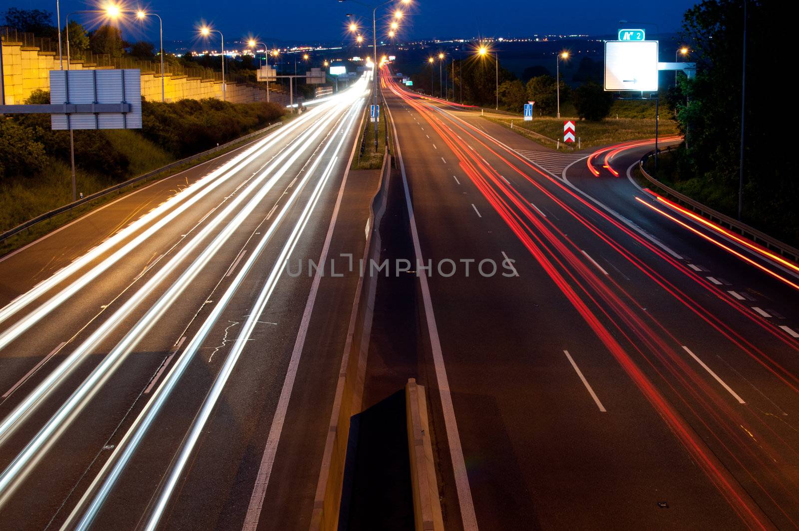 Lights on Cars in Motion on Night Highway