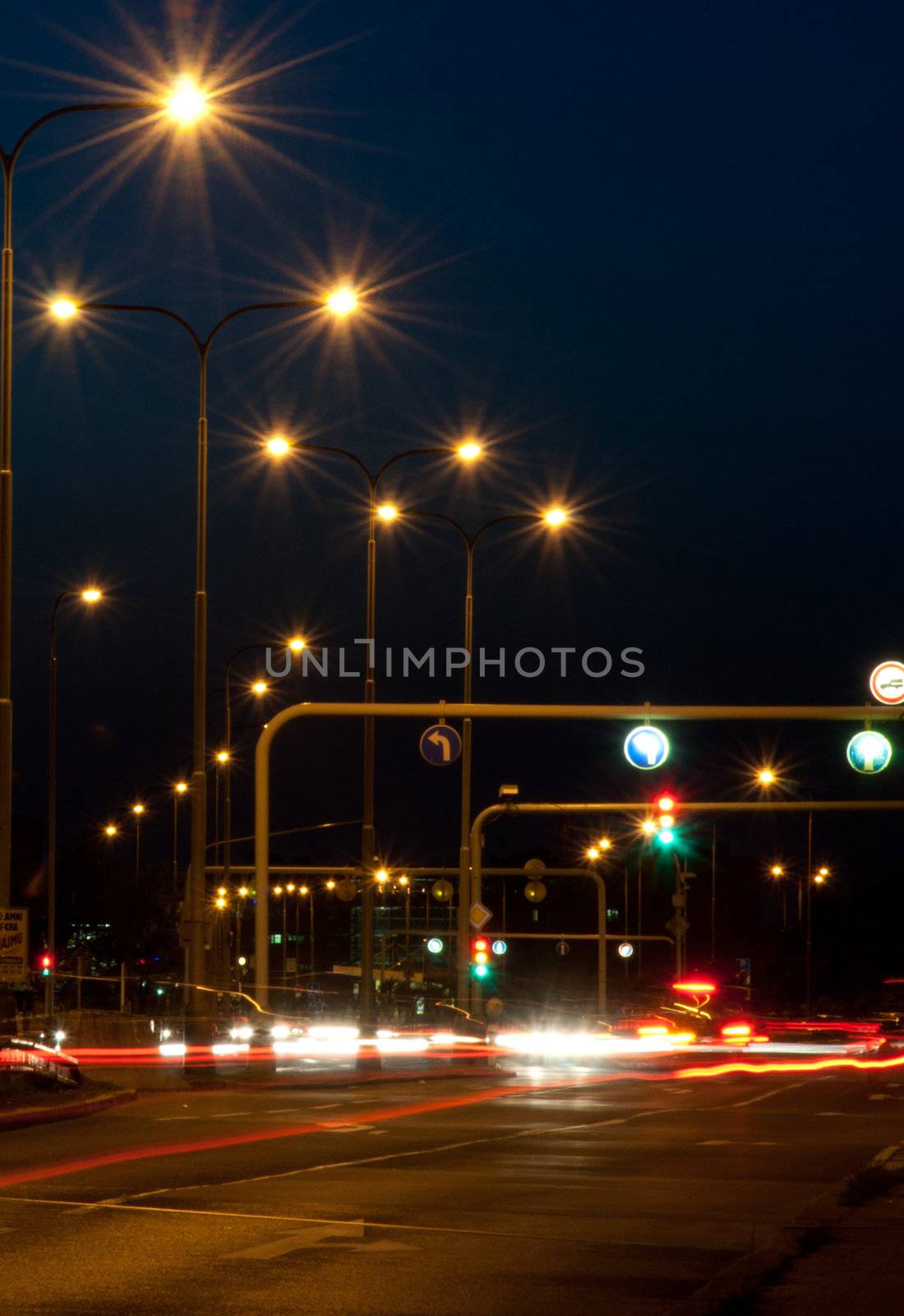 Crossing - Moving Cars and Traffic Lights in the Night

