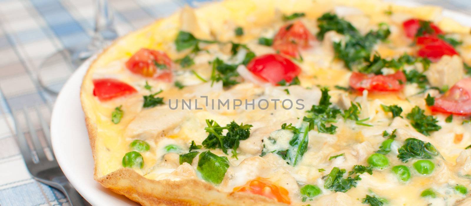 Omelette With Tomatoes, Parsley, Peas and Cheese