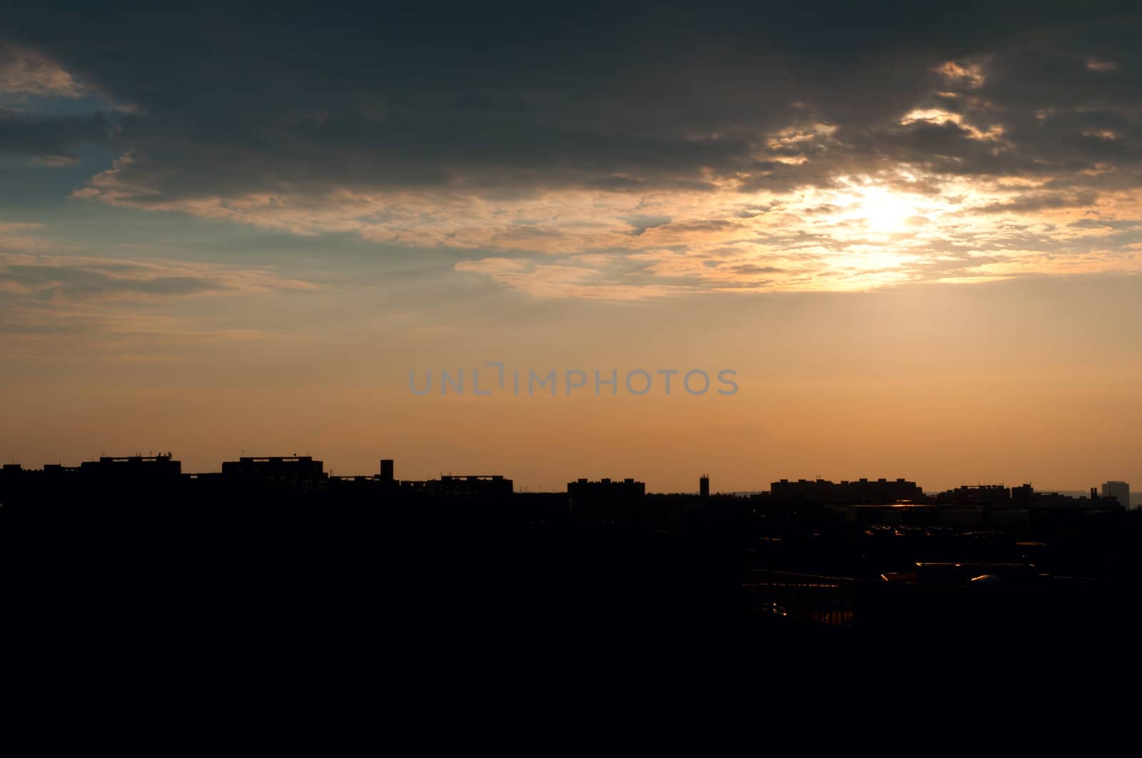 Sunset over Silhouette of City LIne