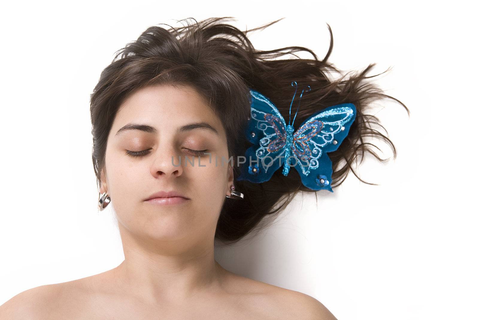 beautiful young woman with blue butterfly in the hair