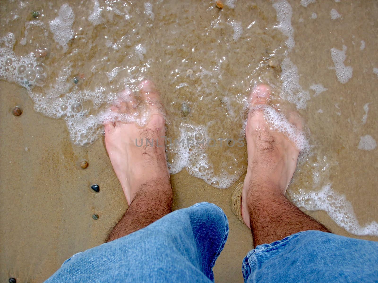 The ocean is washing ashore on my piggie toes.

