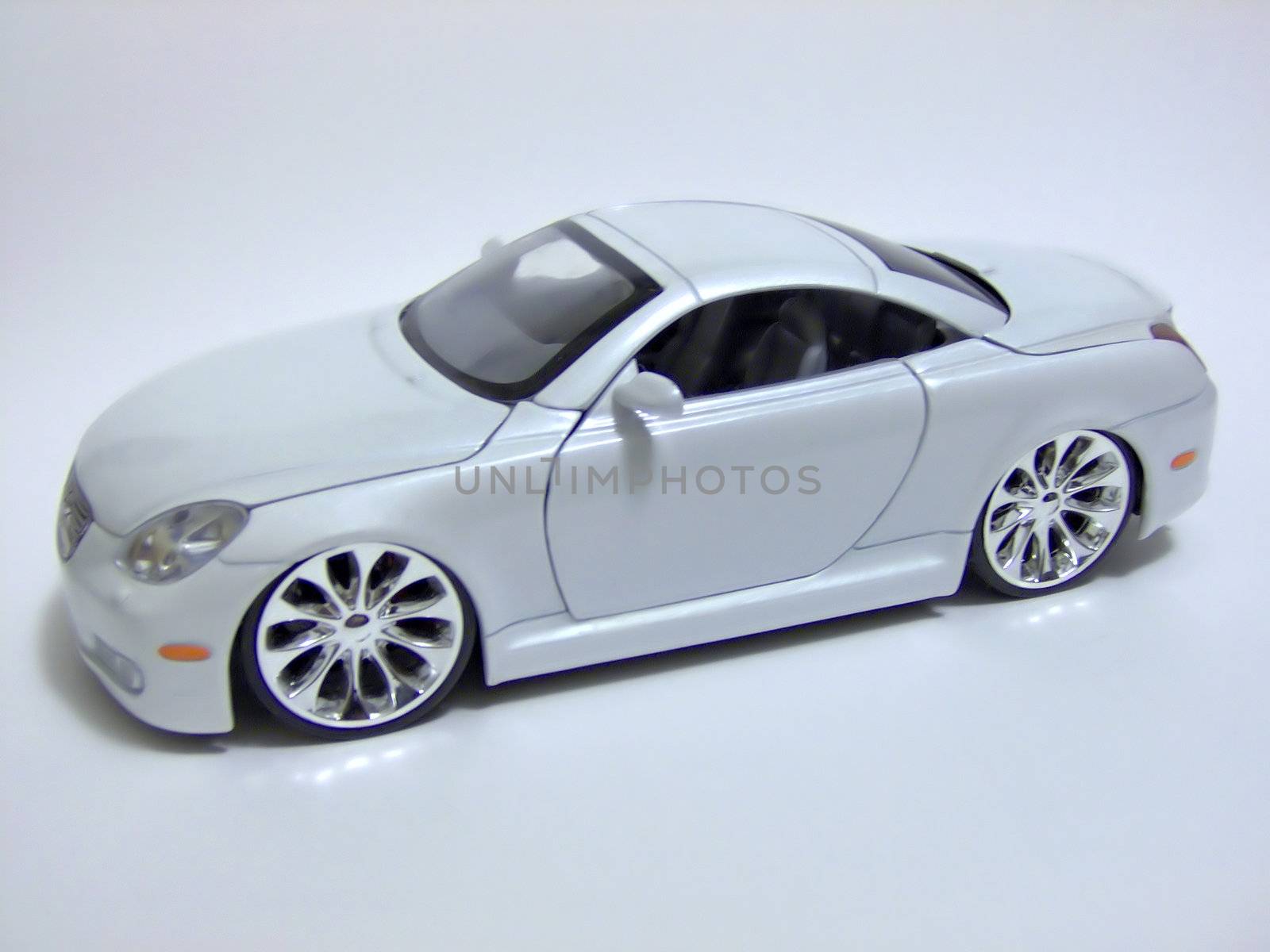 white sports car toy by graficallyminded