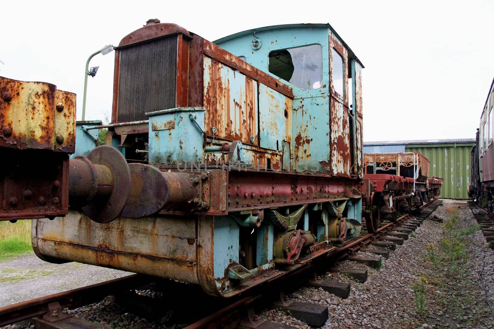 Vintage diesel powered train being renovated. Rusty condition