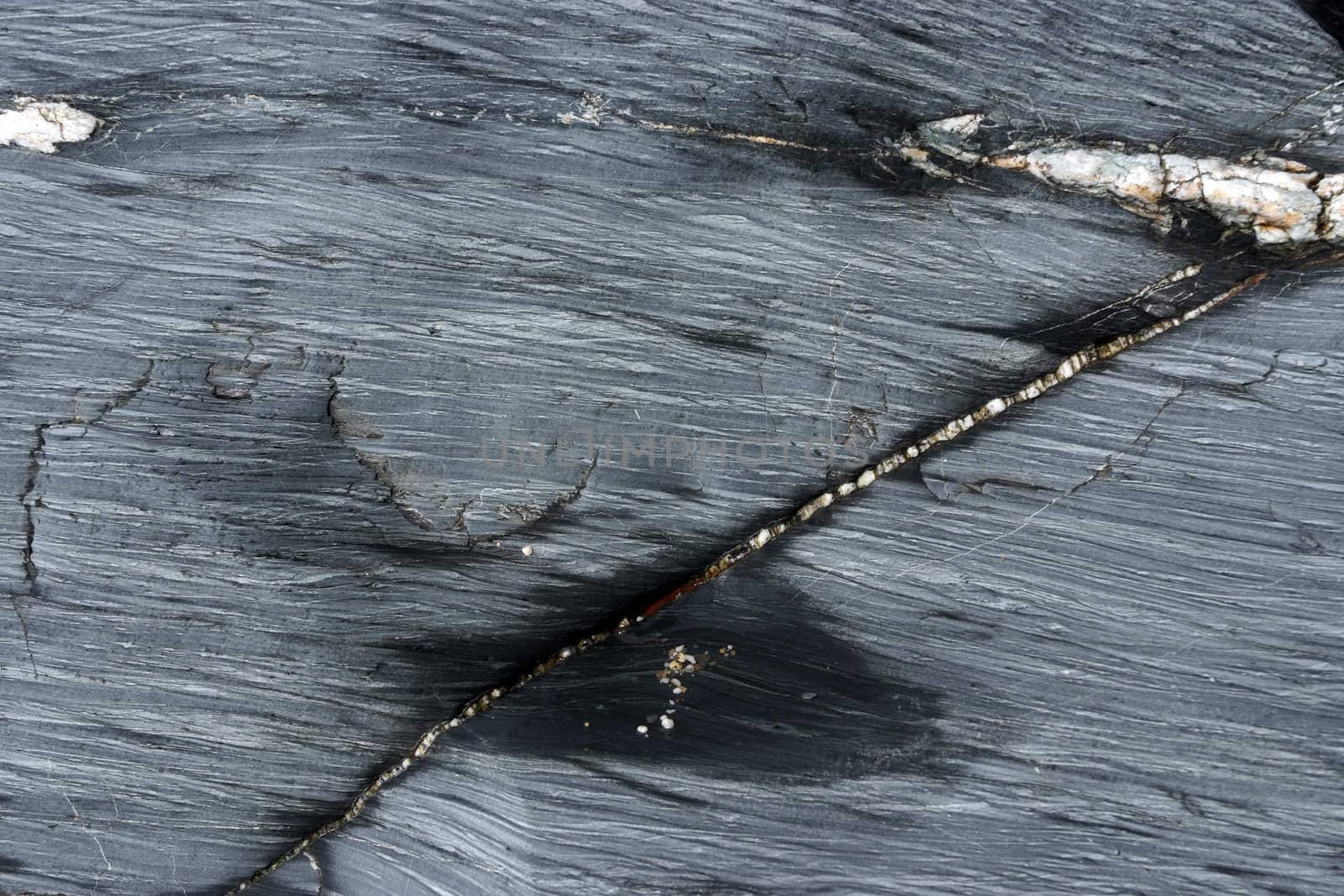 A slate rock worn down by the sea