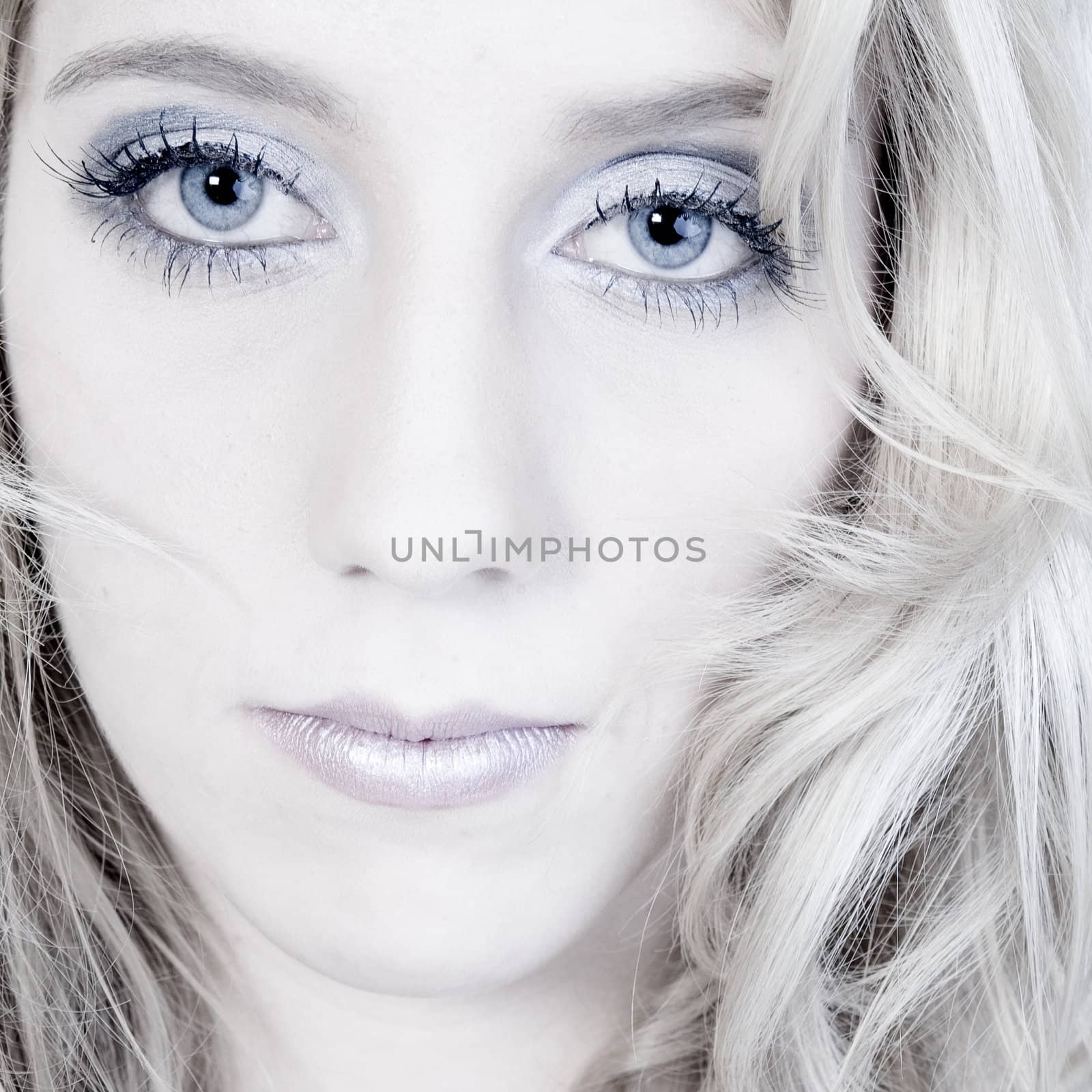Studio portrait of a long blond girl looking hurt by DNFStyle