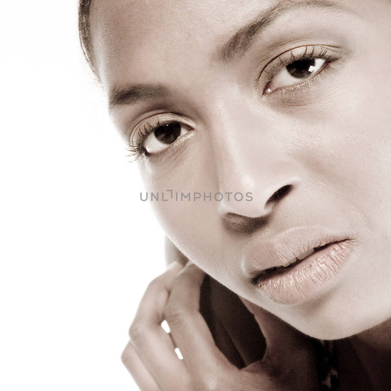 A beauty portrait taken from an african model in the studio with a serious look