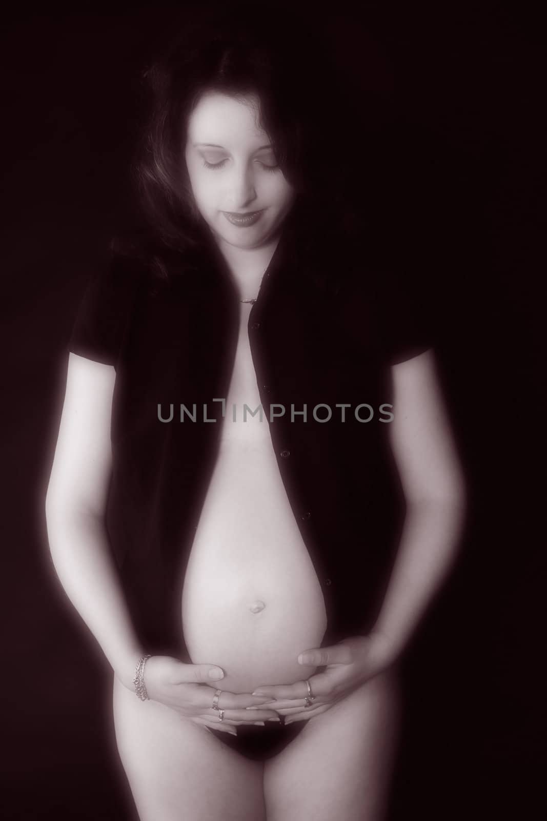 a pregnant woman model portrait in the studio