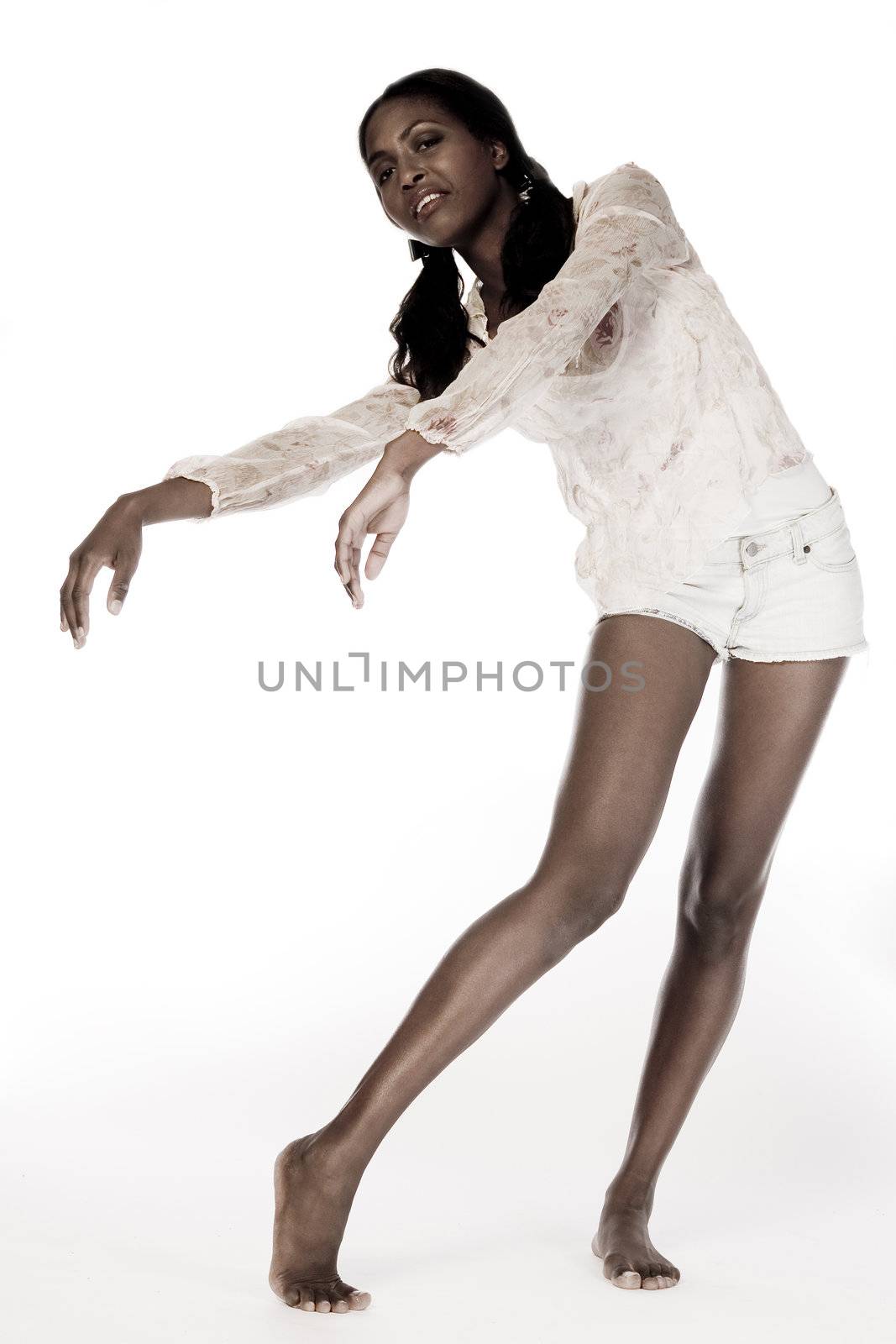 A beauty portrait taken from an african model in the studio being flexible